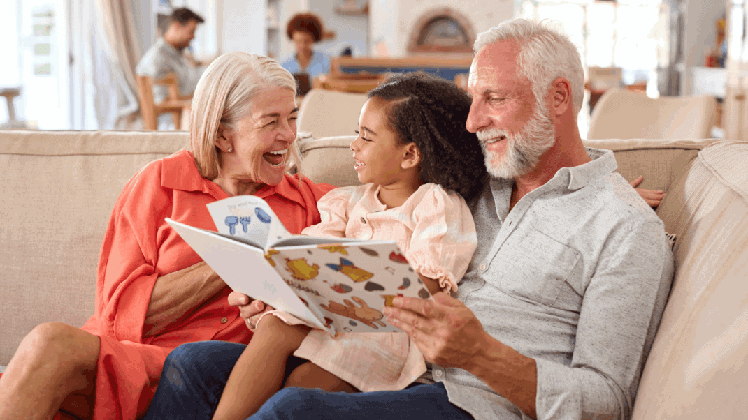 toddler with grandparents at school